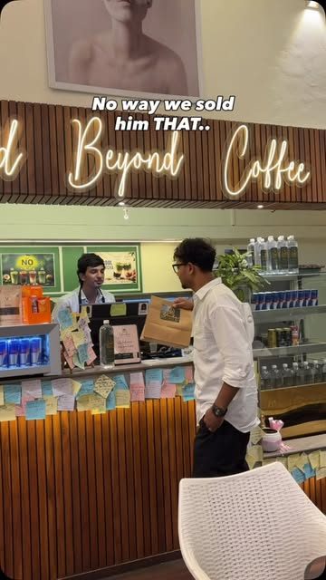 Counter under the 'Crafted Beyond Coffee' neon sign